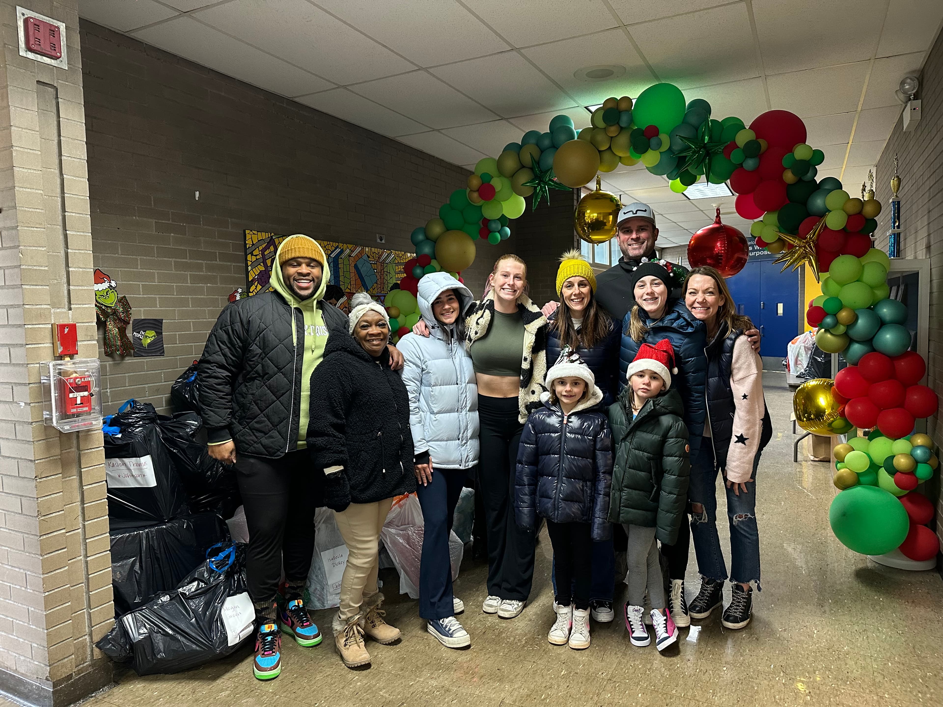 Children holding gifts from Project LUK