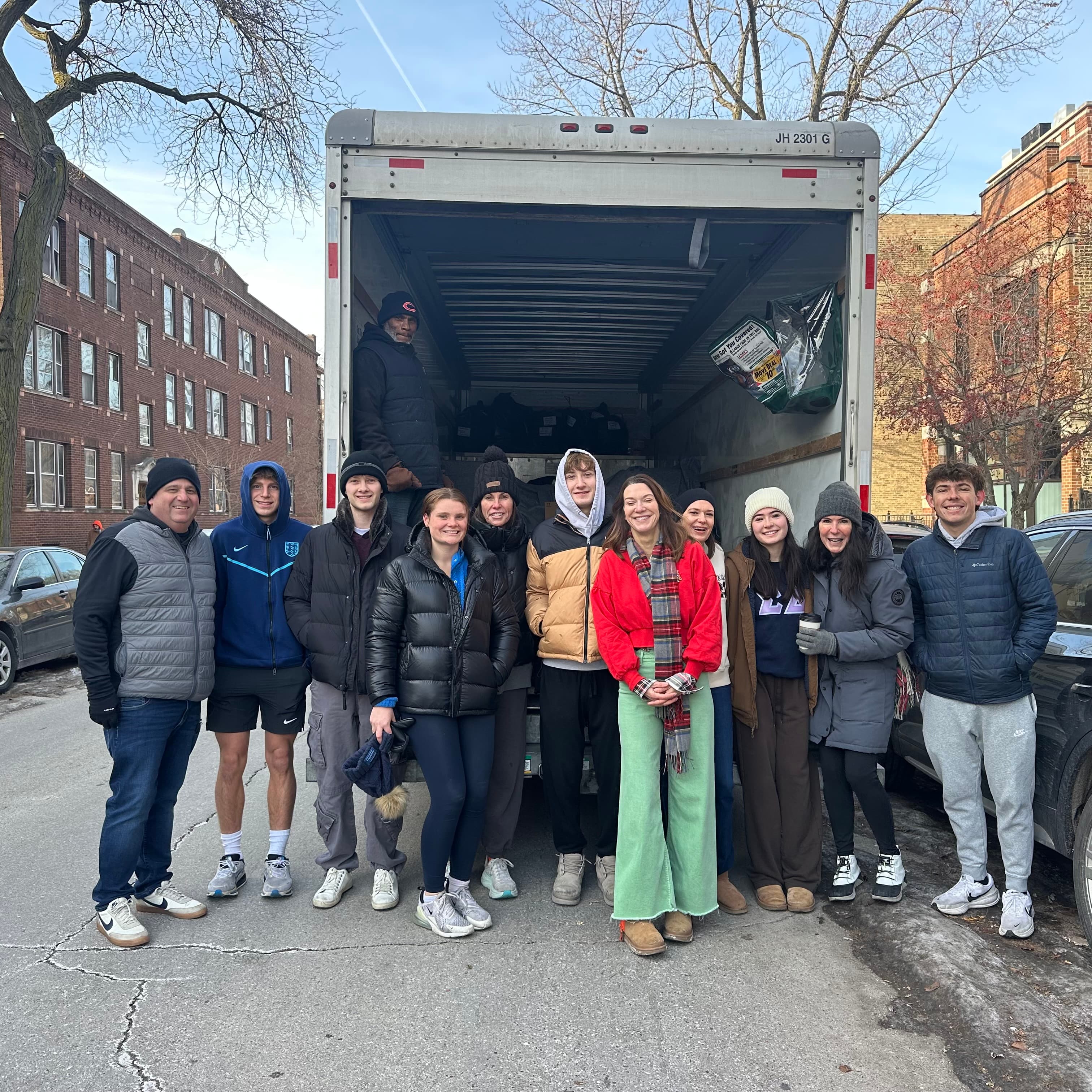 Volunteers unloading gifts from a truck